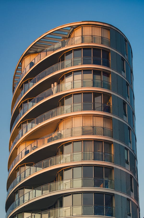 curved glass building sunset